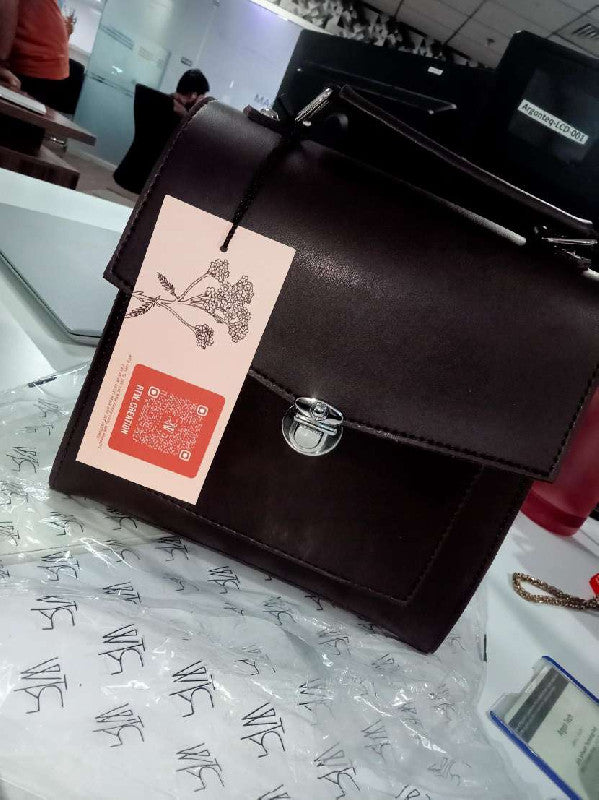 Dark brown push-lock messenger bag