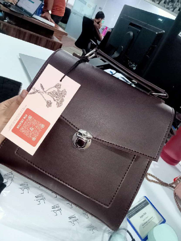 Dark brown push-lock messenger bag